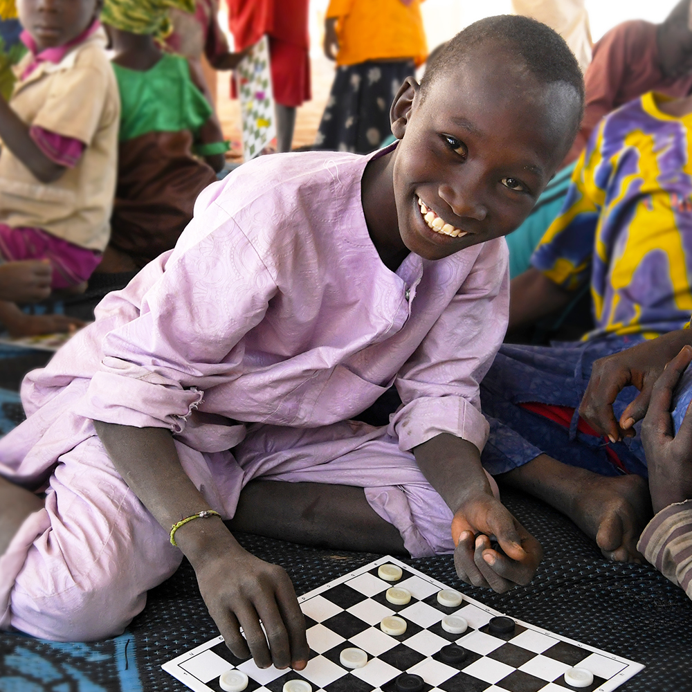 Barn spiller brettspill, Tsjad